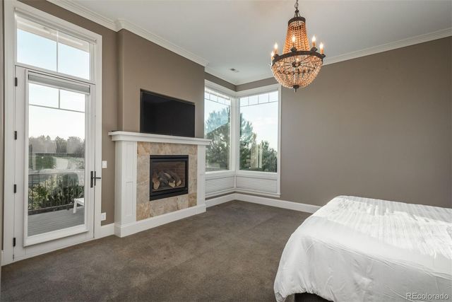 a bed sitting in a room next to a window