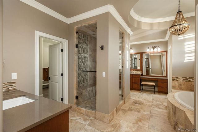 a bathroom with a tub shower and sink