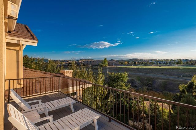 a view of balcony with wooden floor and lake view