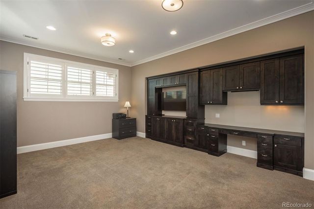 wooden floor in kitchen with stainless steel appliances granite countertop a refrigerator and a stove