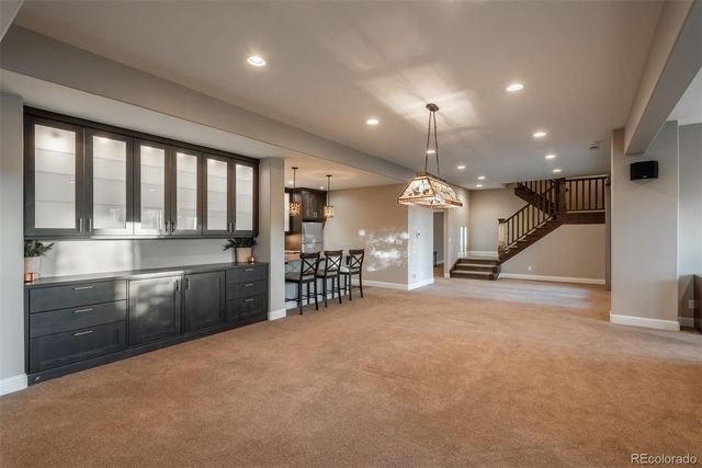 a large room with lots of chairs and a large window