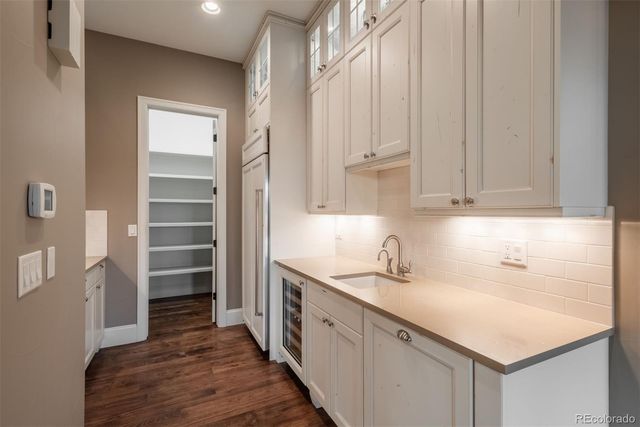 a kitchen with a sink and cabinets
