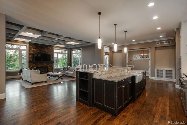 a kitchen with sink stove and cabinets