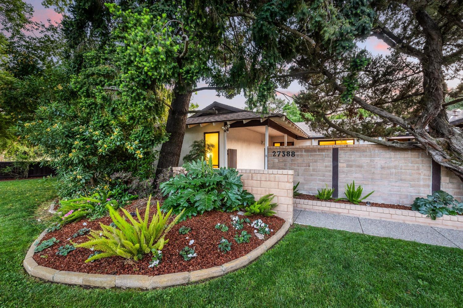 a view of a house with a small yard