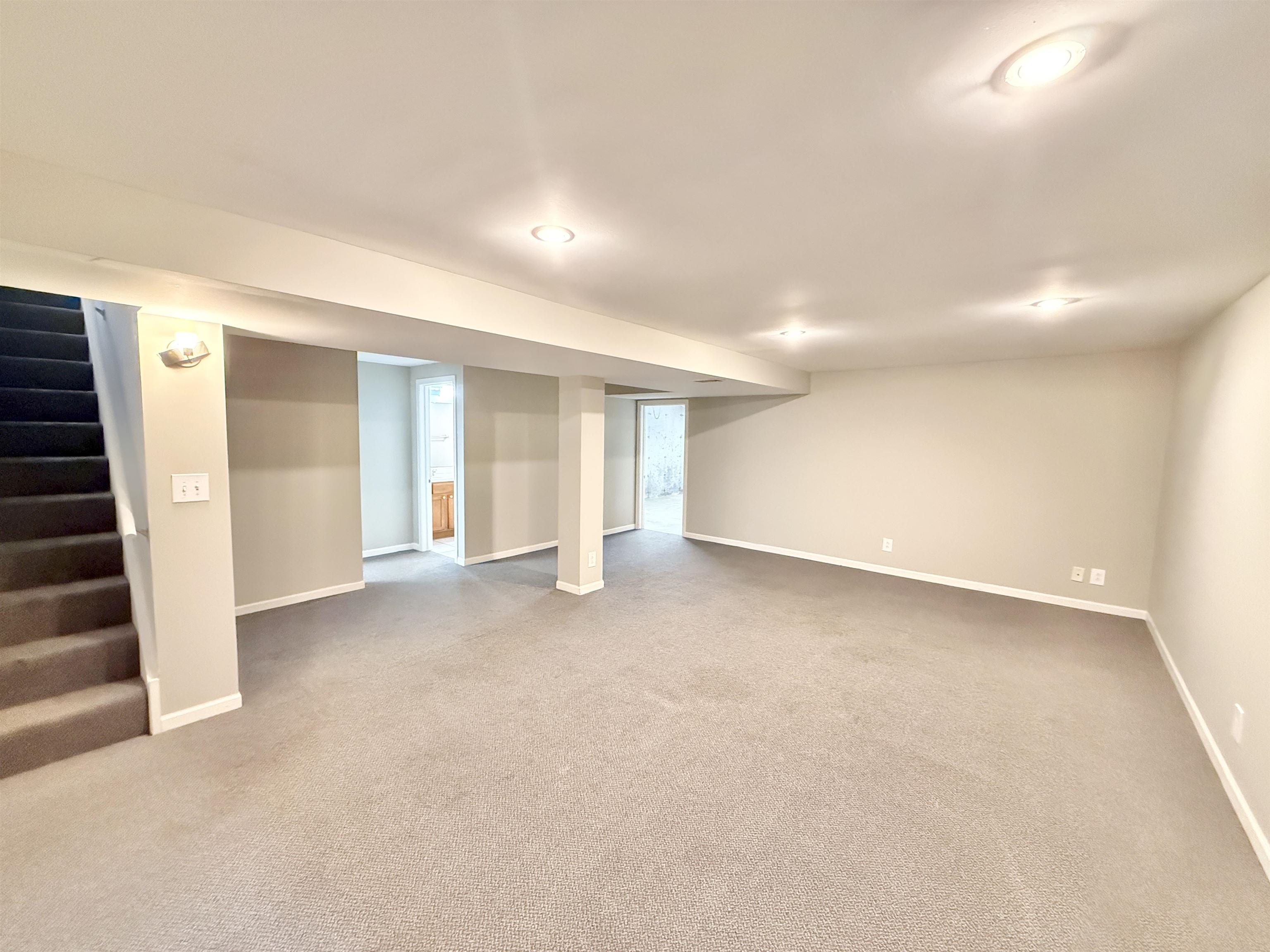 10620 Grover Oaks Road Roscoe, IL 61073 - Photo 13 of 32 a view of an empty room with wooden floor and windows