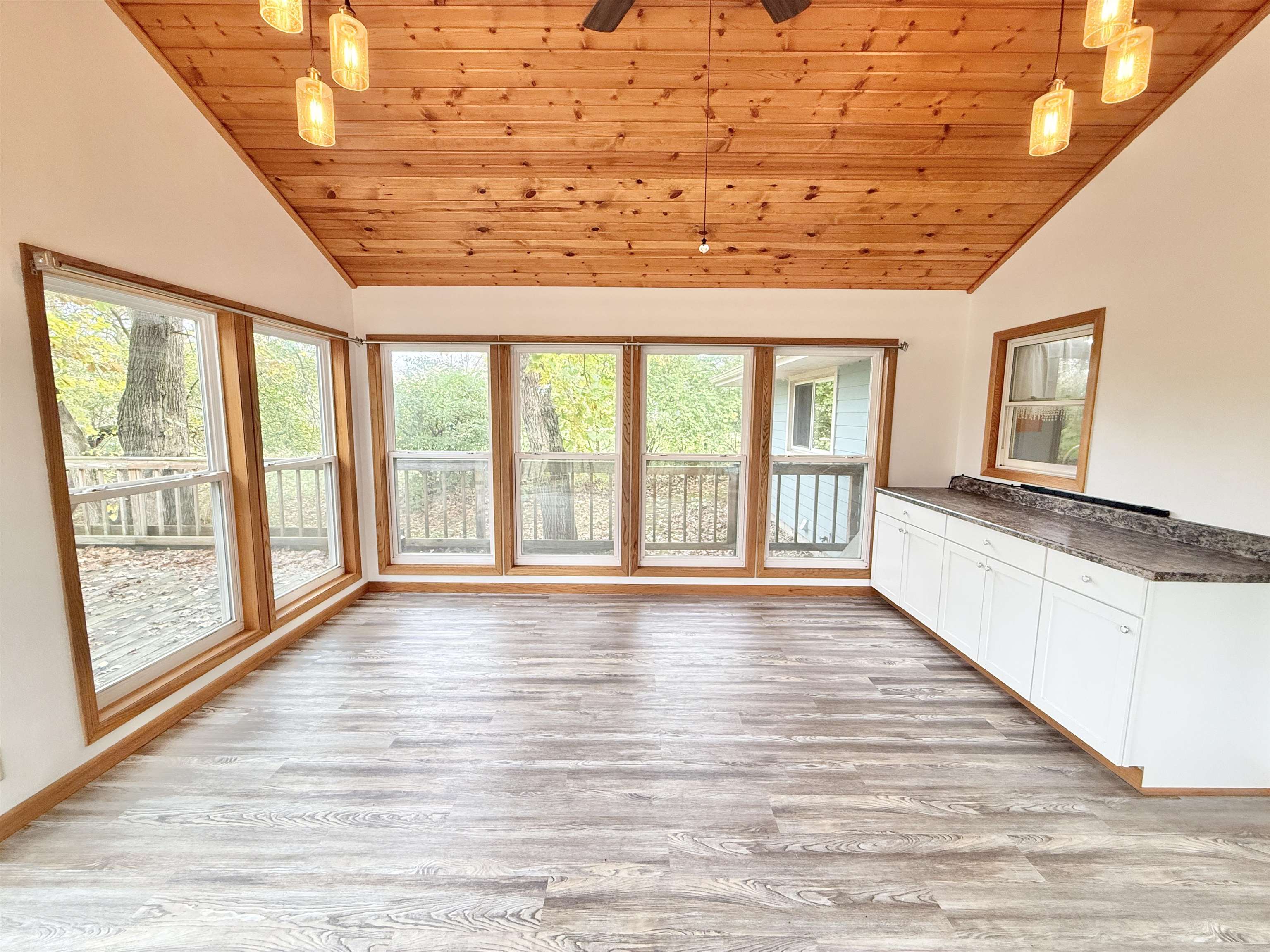 10620 Grover Oaks Road Roscoe, IL 61073 - Photo 24 of 32 a view of an empty room with wooden floor and a window