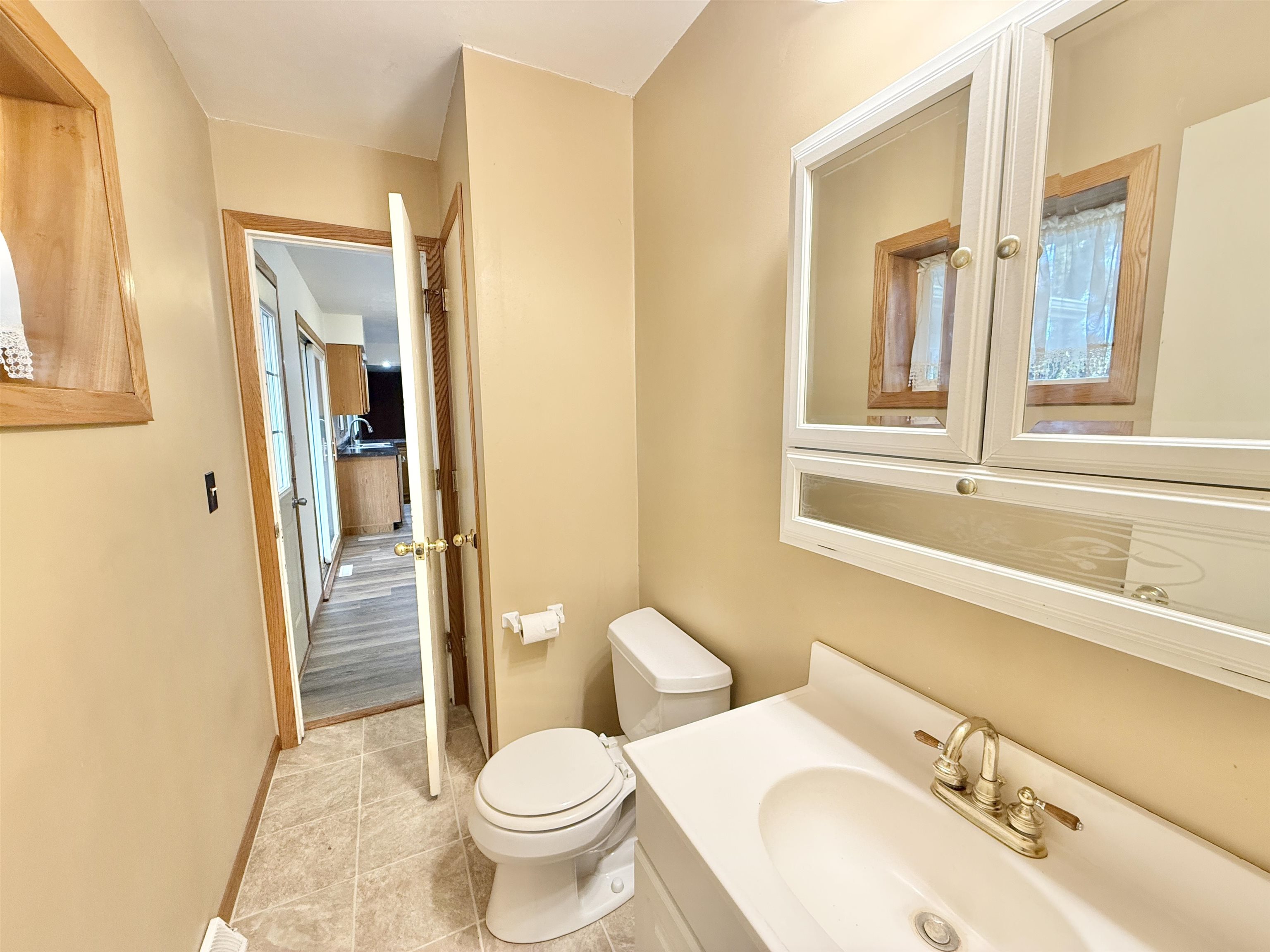 10620 Grover Oaks Road Roscoe, IL 61073 - Photo 8 of 32 a bathroom with a sink and a toilet