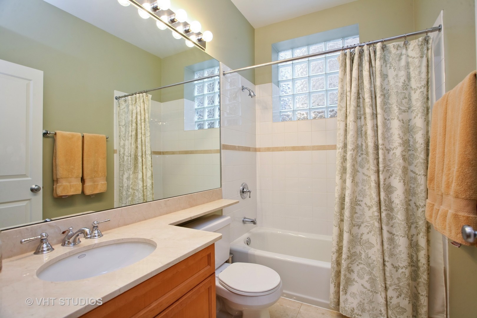 821 Foster Street, Unit 1S Evanston, IL 60201 - Photo 12 of 14 a bathroom with a granite countertop sink toilet and shower