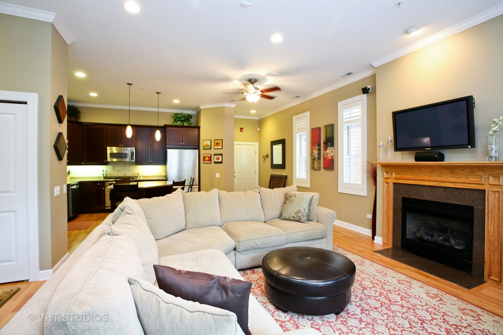 821 Foster Street, Unit 1S Evanston, IL 60201 - Photo 3 of 14 a living room with furniture a flat screen tv and a fireplace