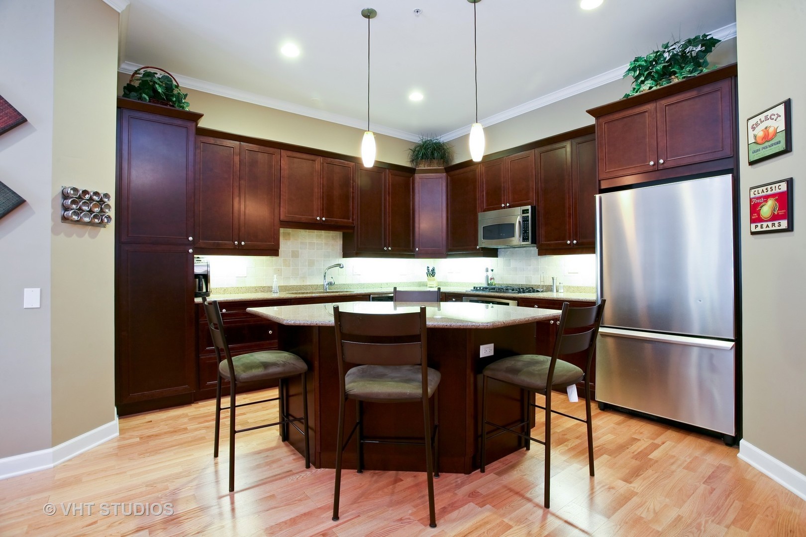 821 Foster Street, Unit 1S Evanston, IL 60201 - Photo 5 of 14 a kitchen with a refrigerator a sink and chairs