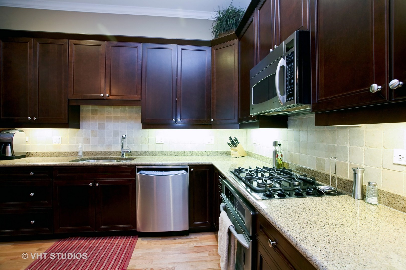 821 Foster Street, Unit 1S Evanston, IL 60201 - Photo 6 of 14 a kitchen with a sink a stove and cabinets