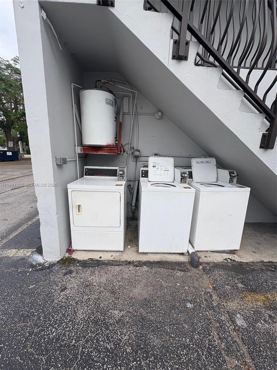 4444 Southwest 67th Avenue, Unit 6 Miami, FL 33155 - Photo 7 of 7 a utility room with dryer and washer