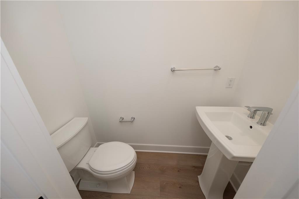 405 Ramsgate Road Cranberry Township, PA 16066 - Photo 26 of 50 a white toilet sitting next to a white sink and vanity