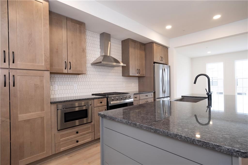 405 Ramsgate Road Cranberry Township, PA 16066 - Photo 29 of 50 a kitchen with granite countertop a sink and a stove