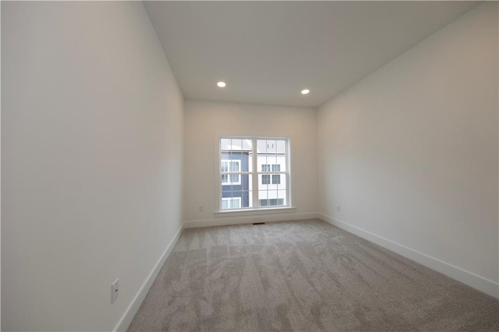 405 Ramsgate Road Cranberry Township, PA 16066 - Photo 32 of 50 an empty room with wooden floor and windows