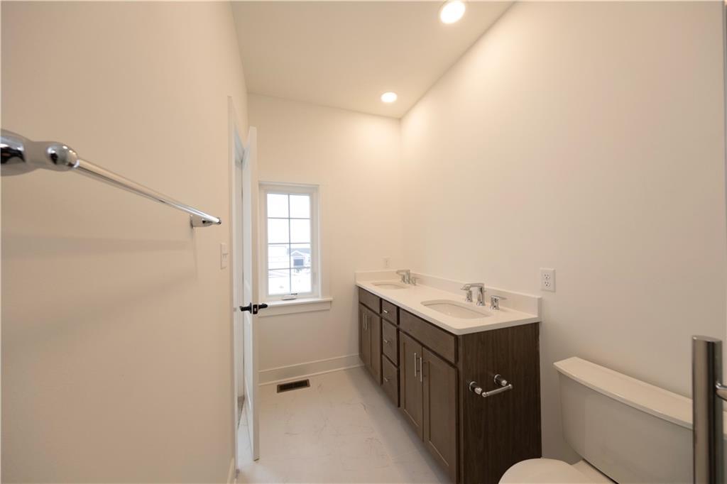 405 Ramsgate Road Cranberry Township, PA 16066 - Photo 45 of 50 a bathroom with a granite countertop sink toilet and shower