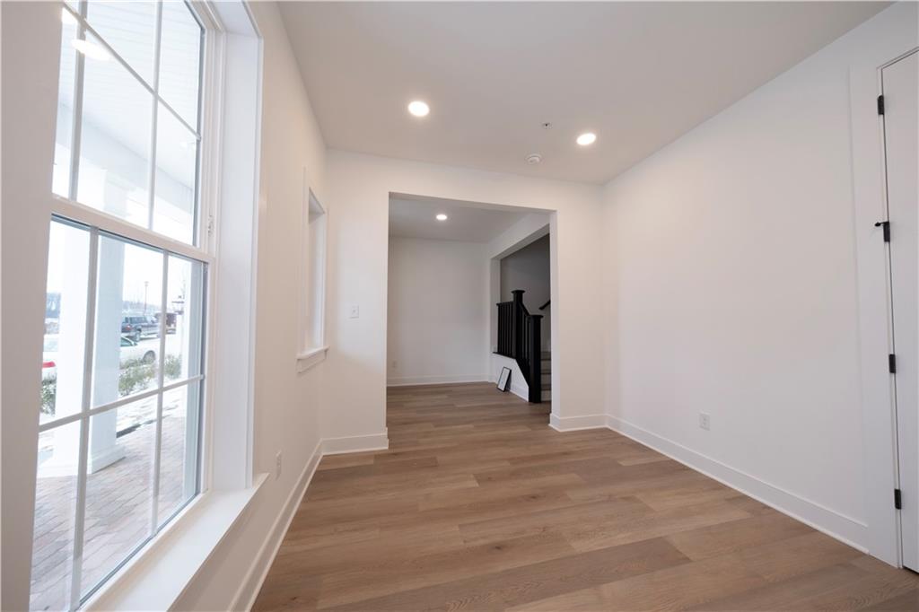 405 Ramsgate Road Cranberry Township, PA 16066 - Photo 7 of 50 a view of an empty room with wooden floor and a window
