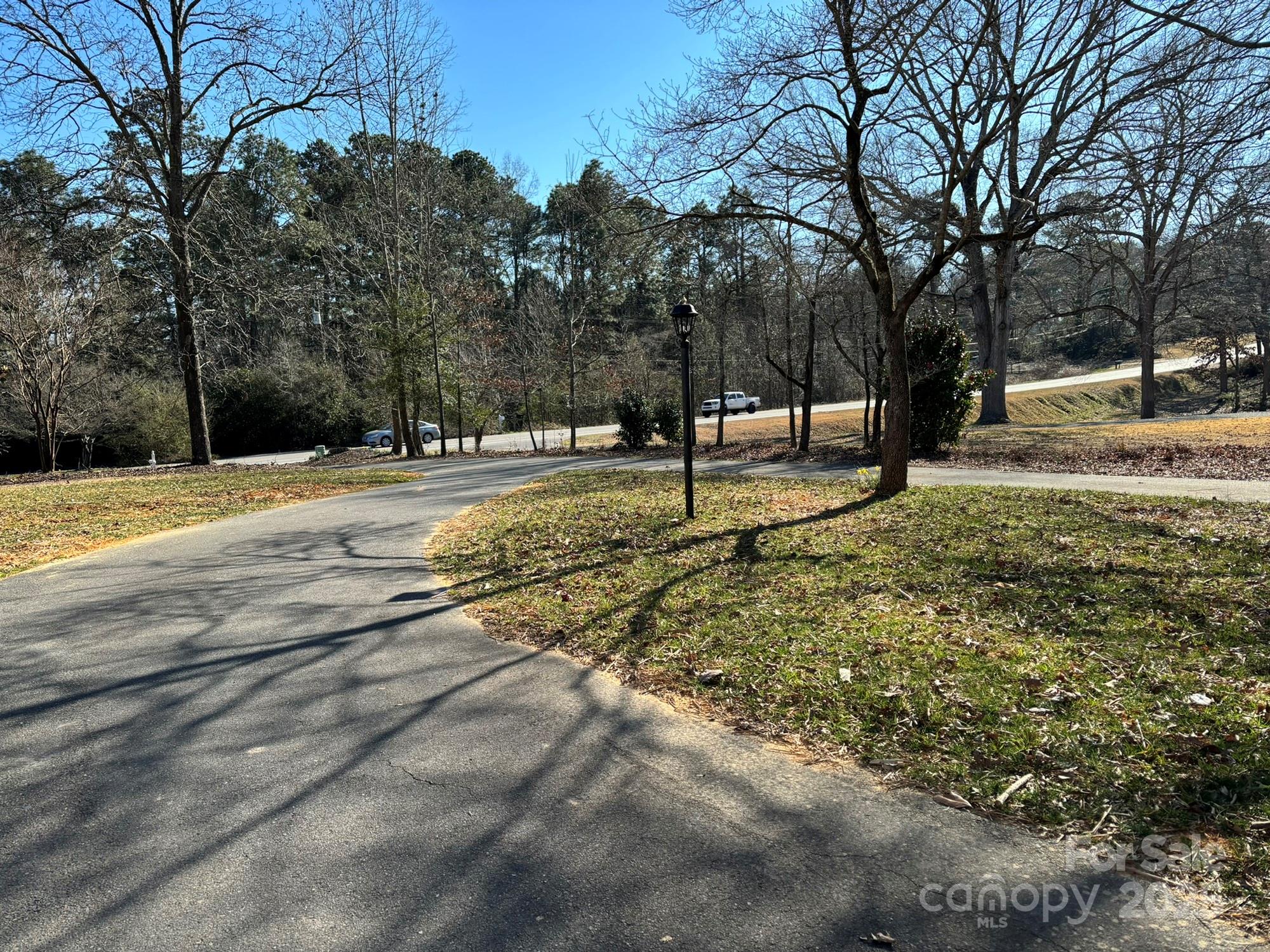 215 Biscoe Road Troy, NC 27371 - Photo 32 of 33 a view of a yard with trees