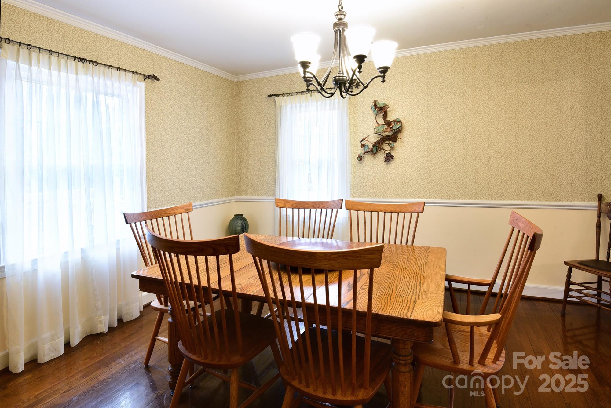 215 Biscoe Road Troy, NC 27371 - Photo 5 of 33 a view of a dining room with furniture and wooden floor