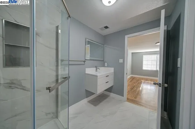 a utility room with cabinets washer and dryer