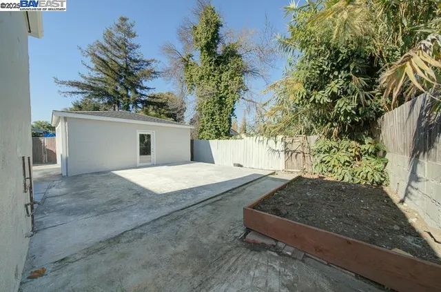 a view of backyard with a outdoor space