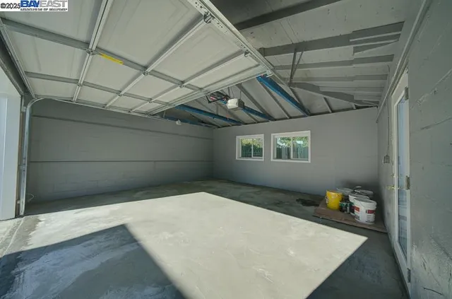 a bedroom with a bed and a wooden floor