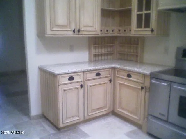 a kitchen with a stove and a sink