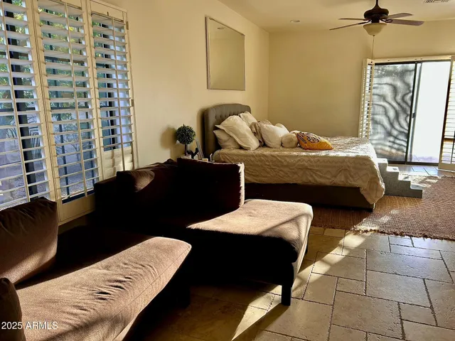 a outdoor dining space with furniture and view of a big room