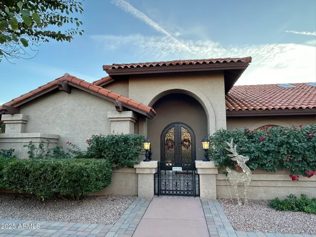 a view of balcony with two chairs and a table