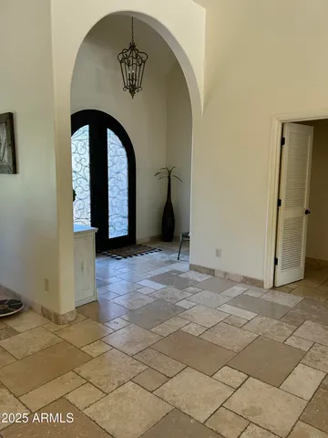 a living room with furniture a rug and a window