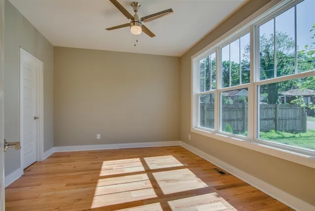 a view of a wooden deck and a yard