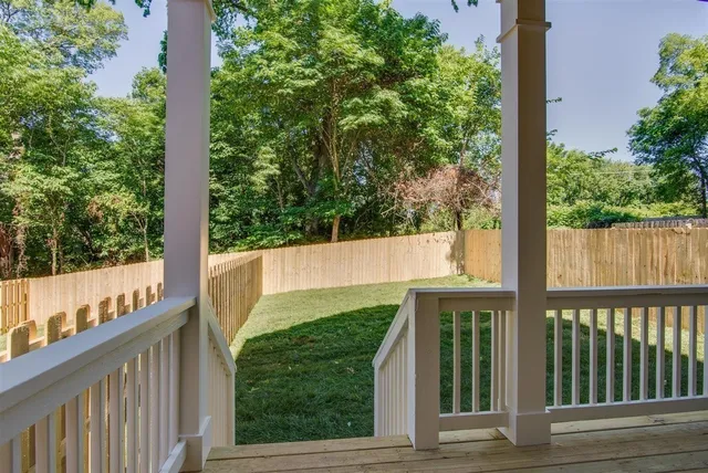 a view of house with backyard