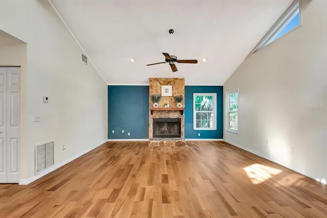 a kitchen with kitchen island granite countertop a sink cabinets and stainless steel appliances