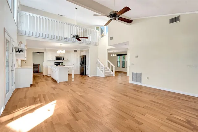 a view of a house with backyard and porch