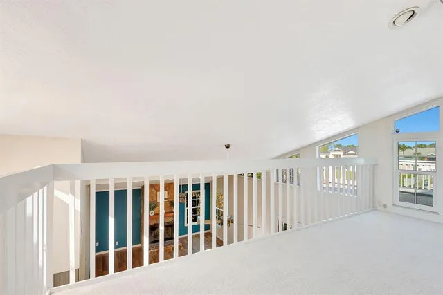 a view of a livingroom with a ceiling fan and window