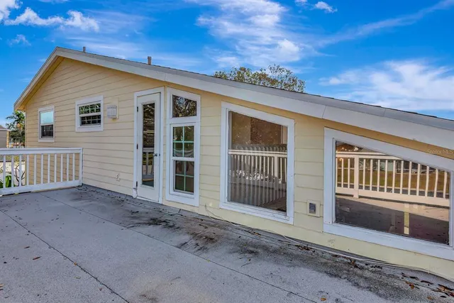 a bath room with a granite countertop tub sink and mirror