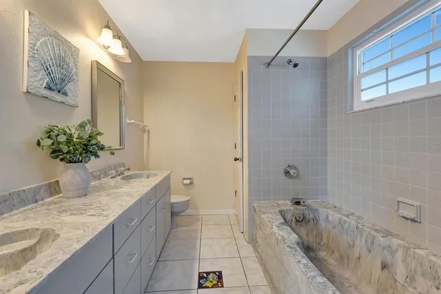 a view of house with outdoor space and sitting area