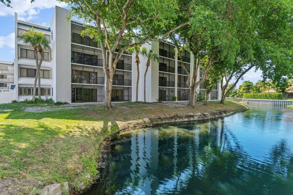 a swimming pool with some trees in the background