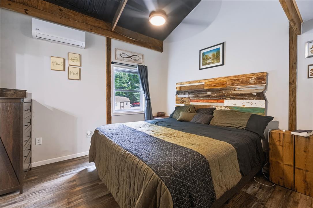74 Turkey Road Kempton, PA 19529 - Photo 41 of 65 GUEST HOME - Exposed wood beams and vaulted ceilings elevate the character of this serene sleeping space.