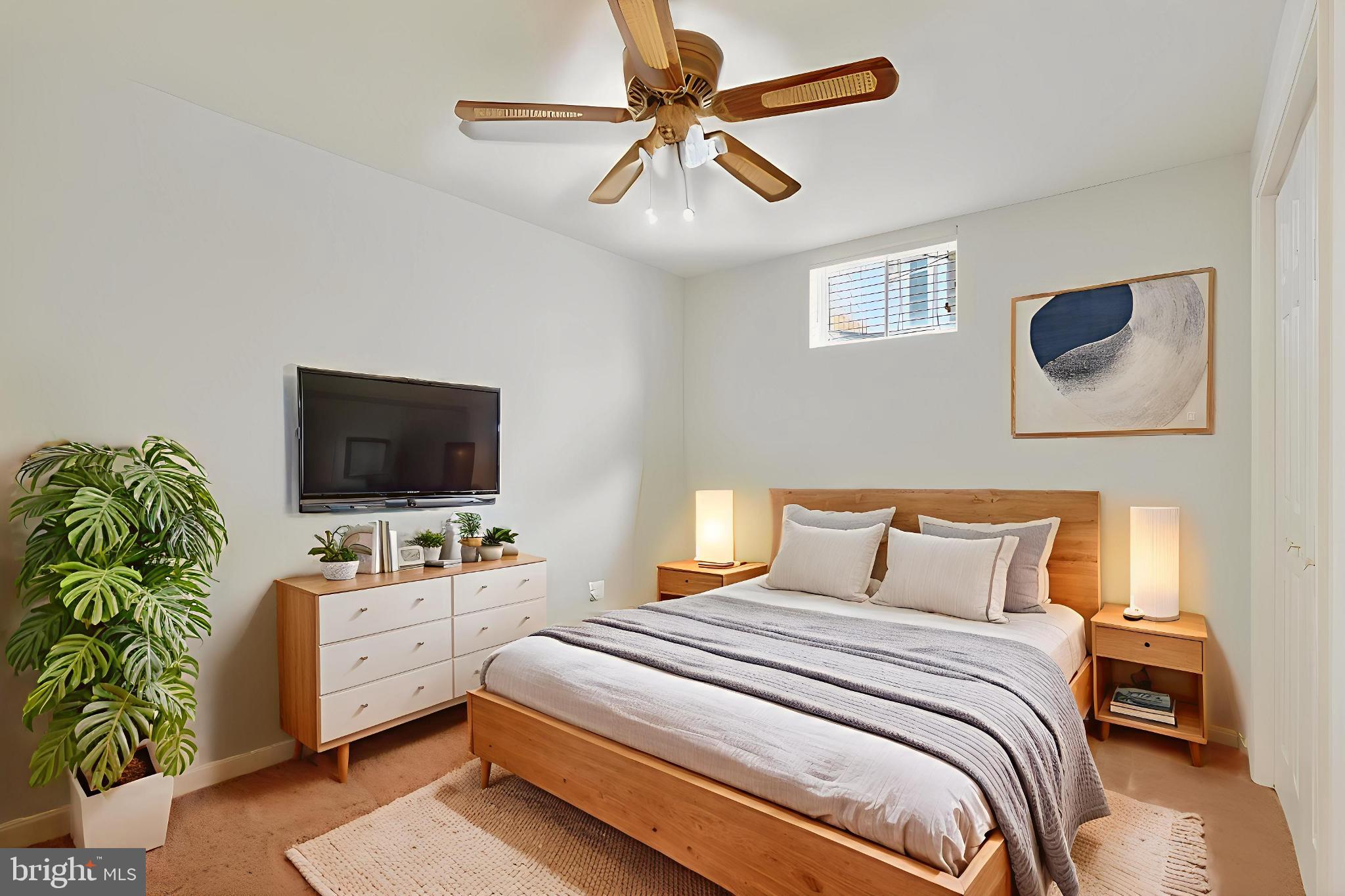 8836 Shadowlake Way Springfield, VA 22153 - Photo 21 of 77 a bedroom with a bed and a flat screen tv