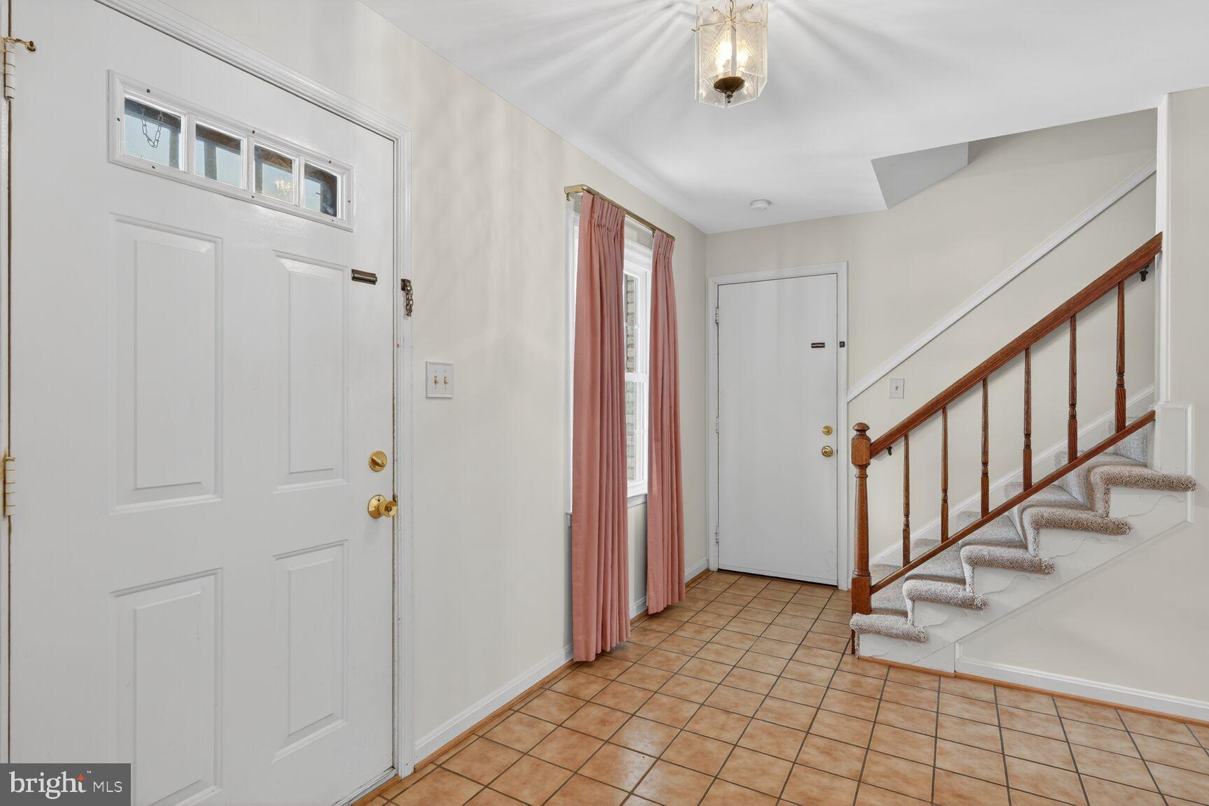 8836 Shadowlake Way Springfield, VA 22153 - Photo 25 of 77 a view of an entryway with wooden floor