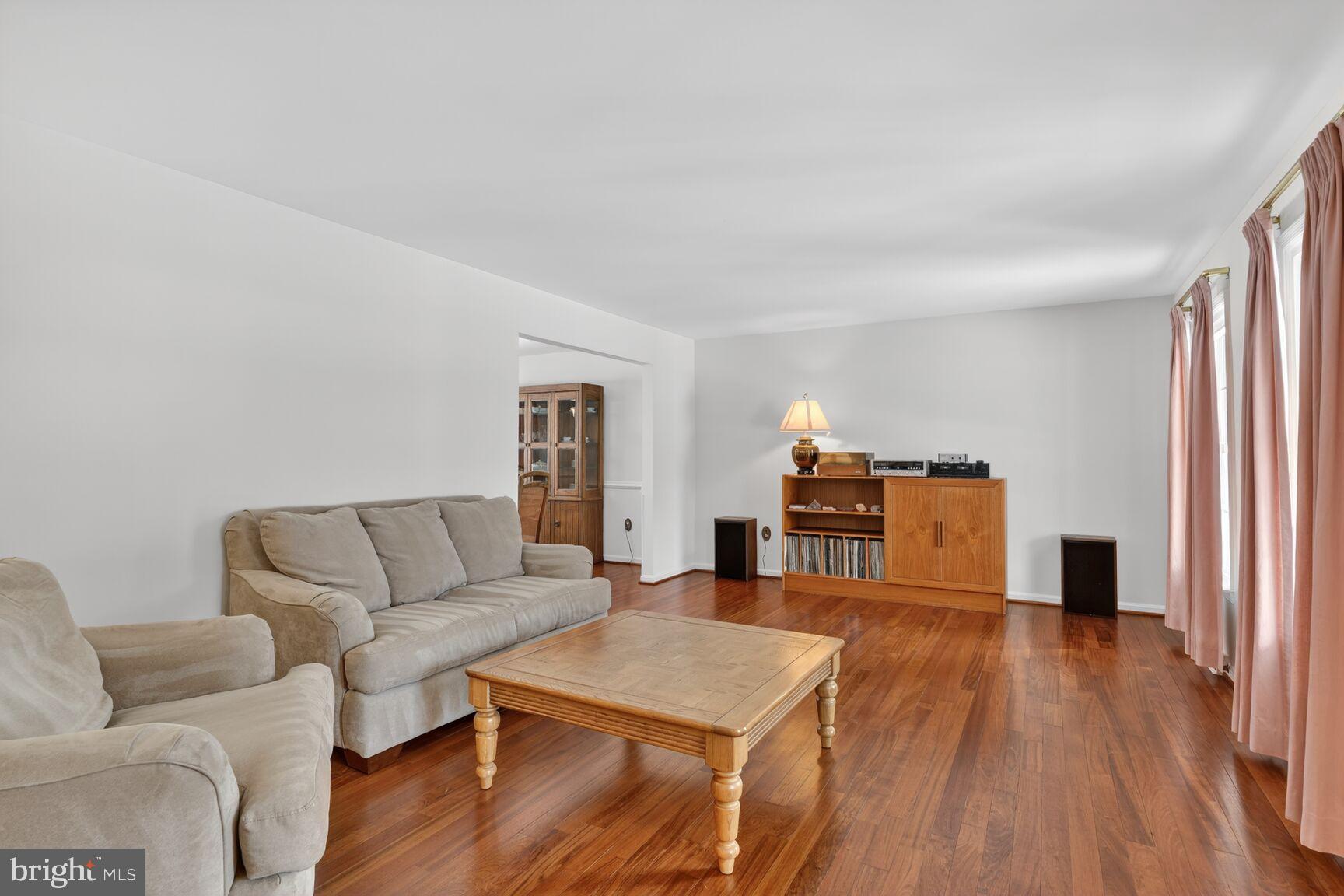 8836 Shadowlake Way Springfield, VA 22153 - Photo 26 of 77 a living room with furniture and a wooden floor