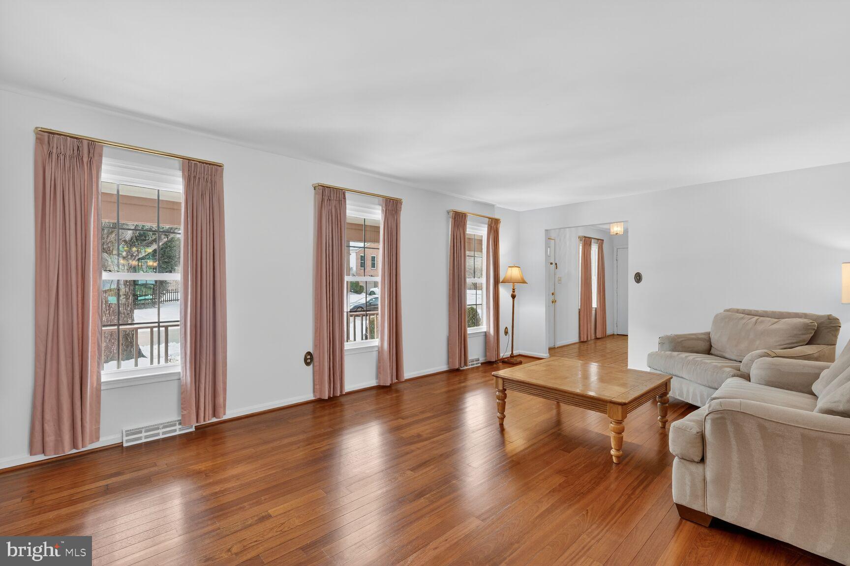 8836 Shadowlake Way Springfield, VA 22153 - Photo 27 of 77 a living room with furniture and wooden floor
