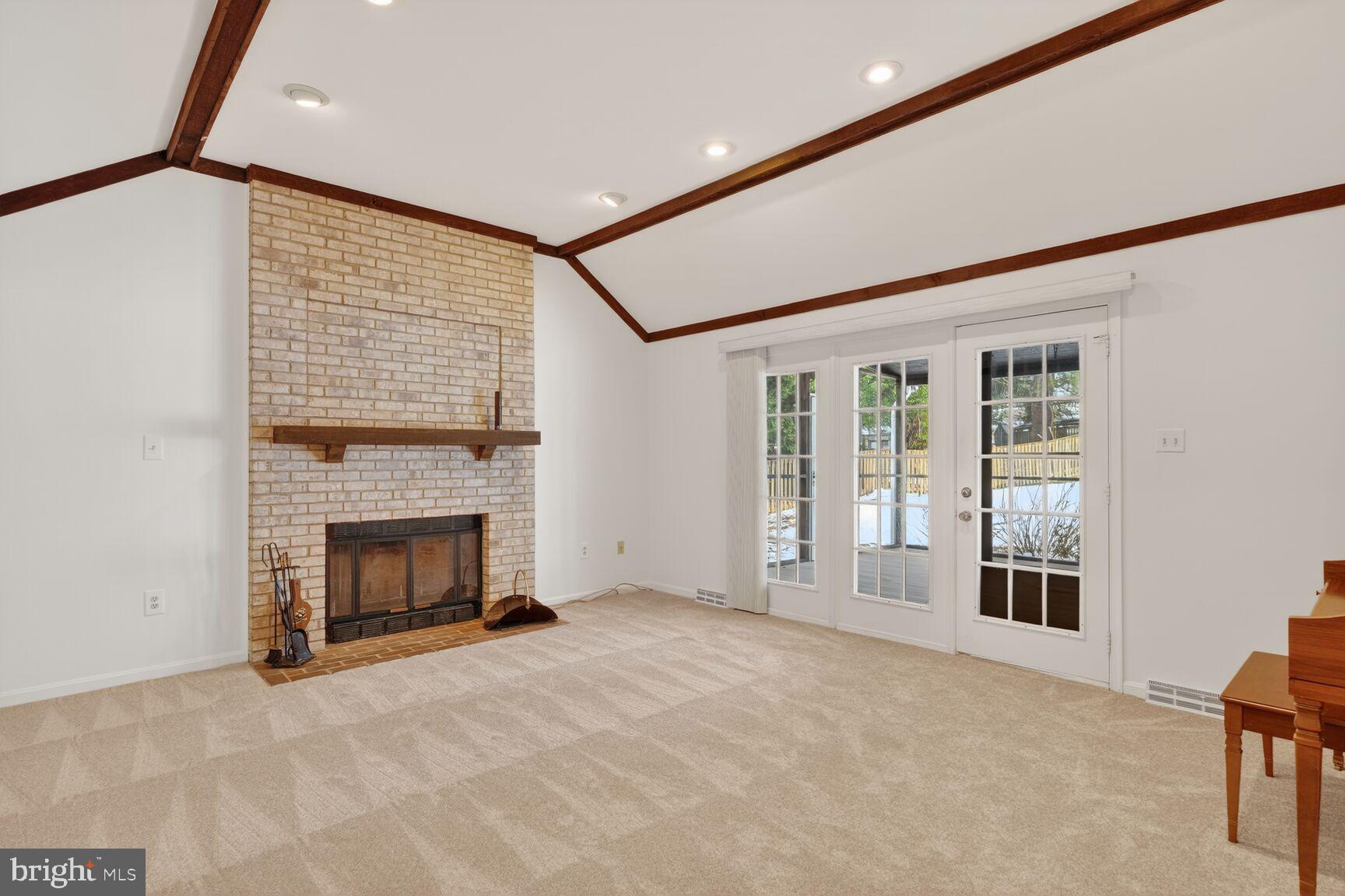 8836 Shadowlake Way Springfield, VA 22153 - Photo 35 of 77 a view of an empty room with a fireplace and a window