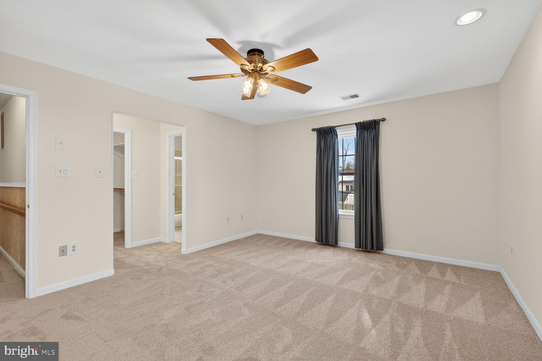8836 Shadowlake Way Springfield, VA 22153 - Photo 40 of 77 a view of an empty room with a ceiling fan