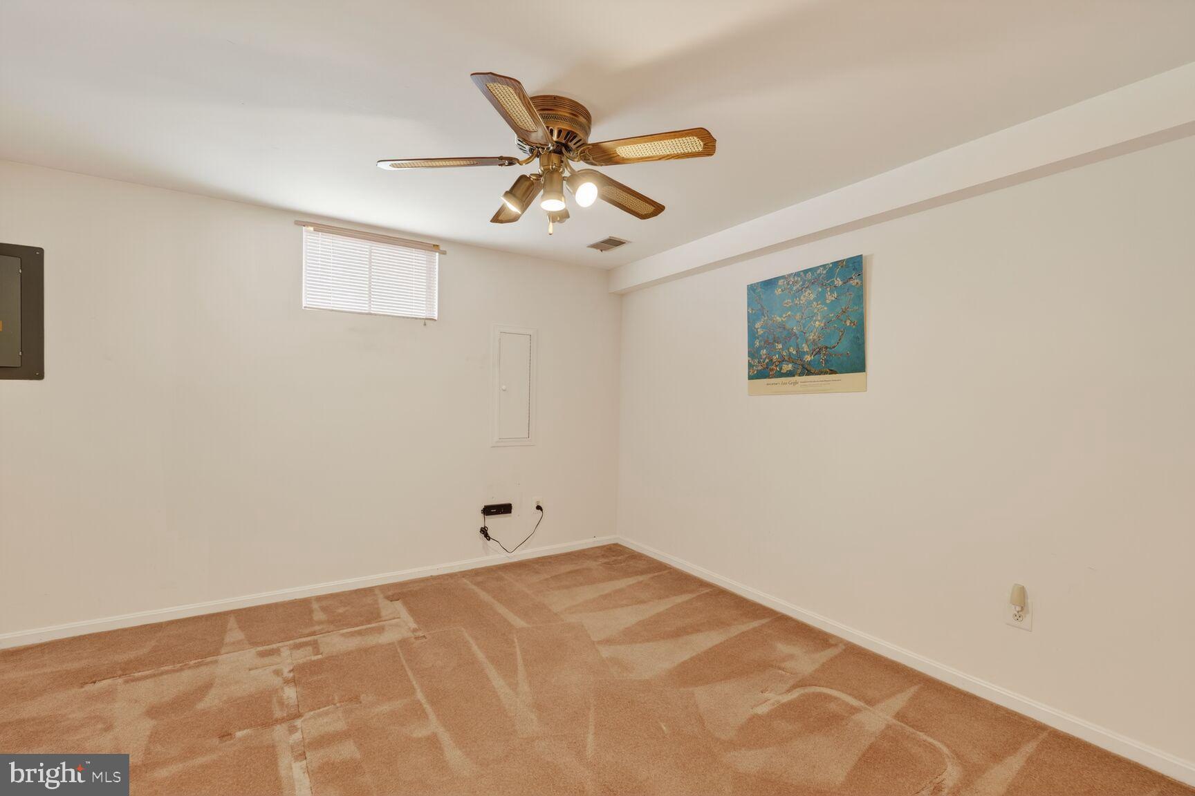 8836 Shadowlake Way Springfield, VA 22153 - Photo 47 of 77 a view of a hallway with a ceiling fan