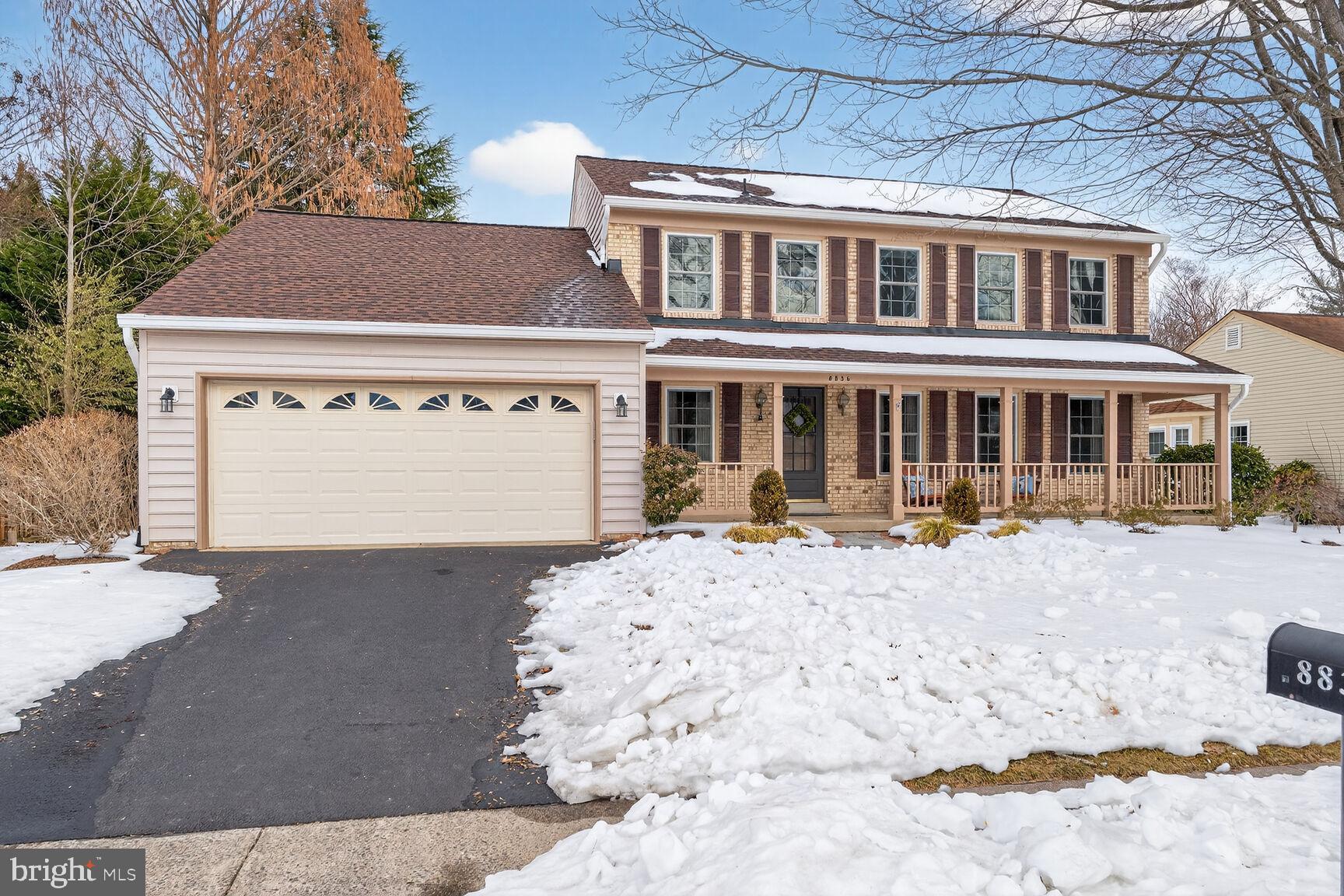 8836 Shadowlake Way Springfield, VA 22153 - Photo 53 of 77 a front view of a house with a yard covered with snow in front of house