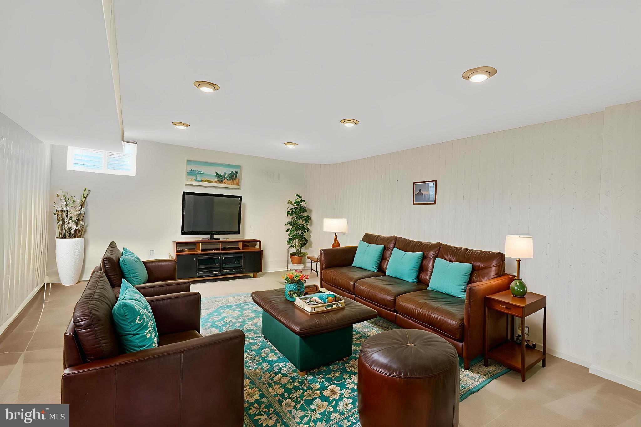 8836 Shadowlake Way Springfield, VA 22153 - Photo 72 of 77 a living room with furniture and a flat screen tv