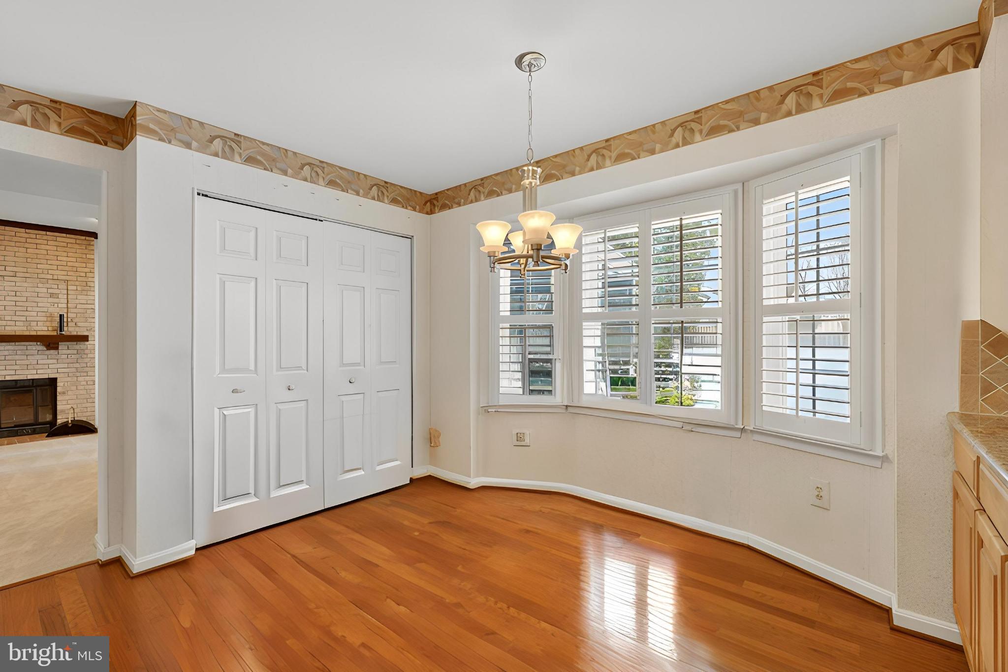 8836 Shadowlake Way Springfield, VA 22153 - Photo 75 of 77 a view of an empty room with wooden floor and a window