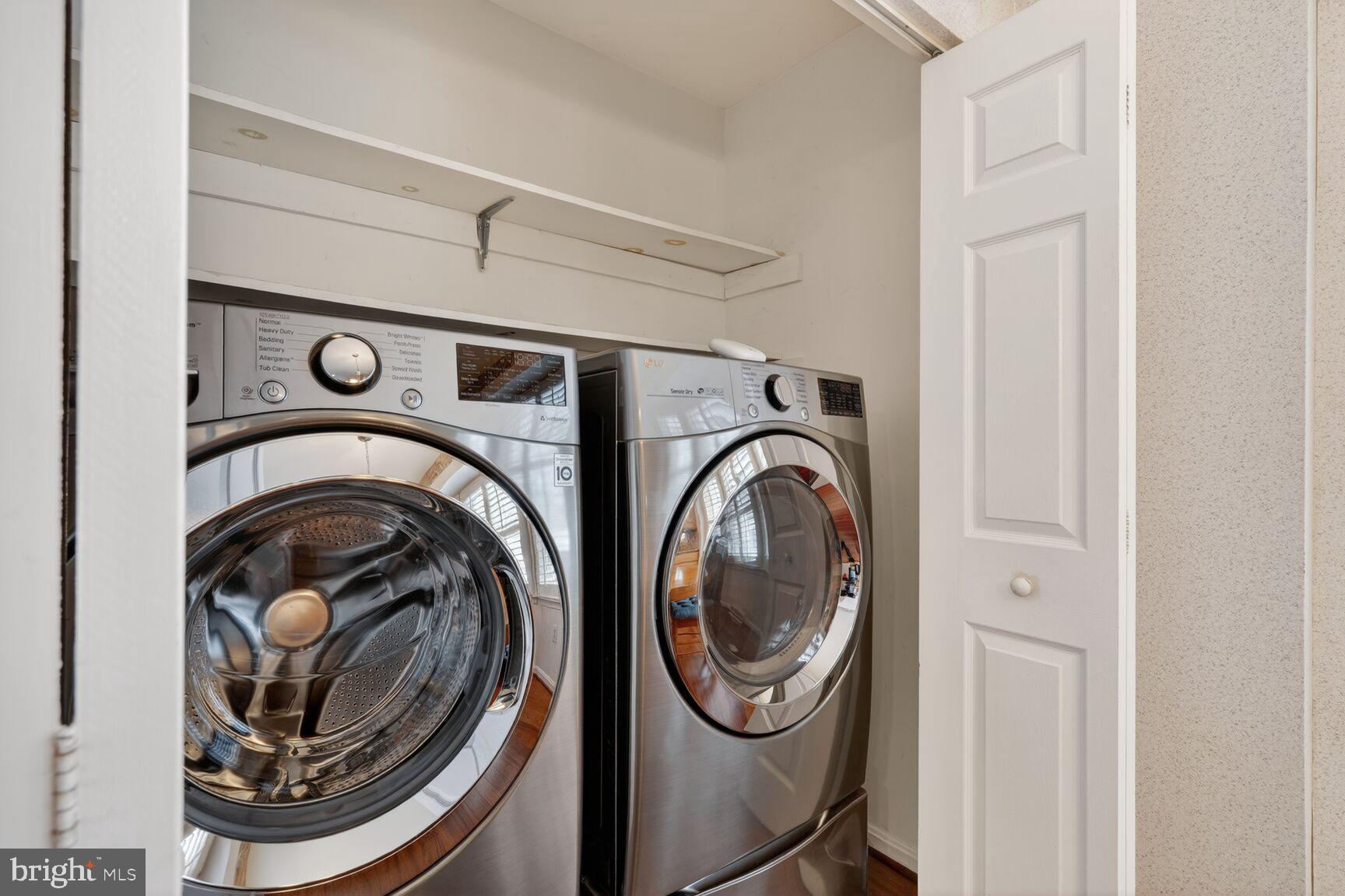 8836 Shadowlake Way Springfield, VA 22153 - Photo 10 of 77 a view of washer and dryer in a utility room